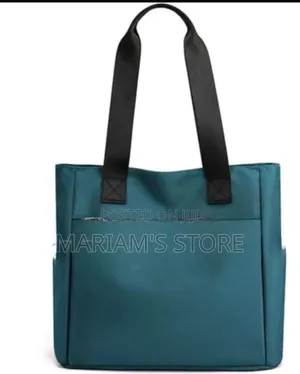 Blue Nylon Utility Tote Features a Front Pocket With a Four-Circle