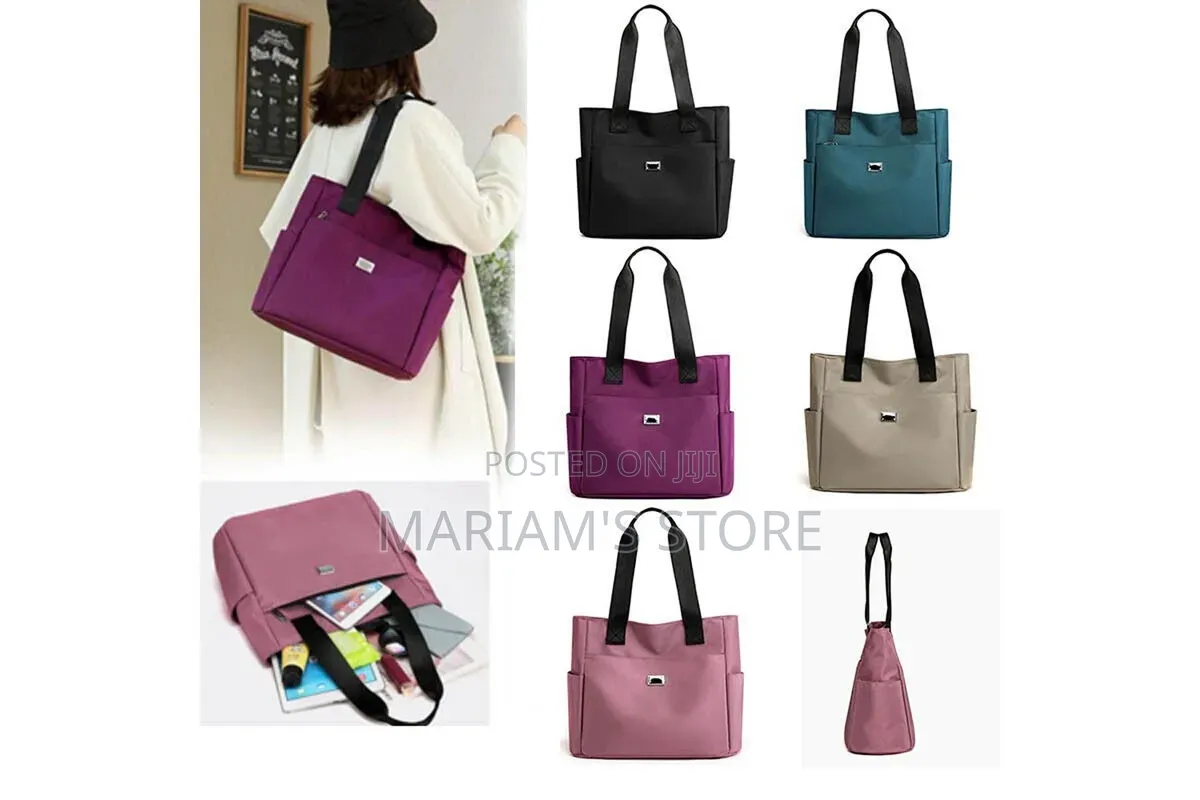 Blue Nylon Utility Tote Features a Front Pocket With a Four-Circle