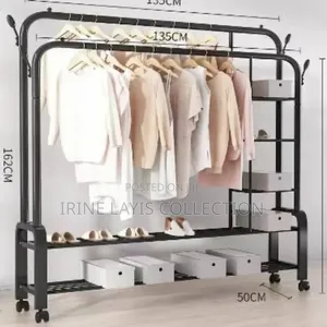 Double Rail Cloth Rack With Integrated Storage Shelves and Hooks.