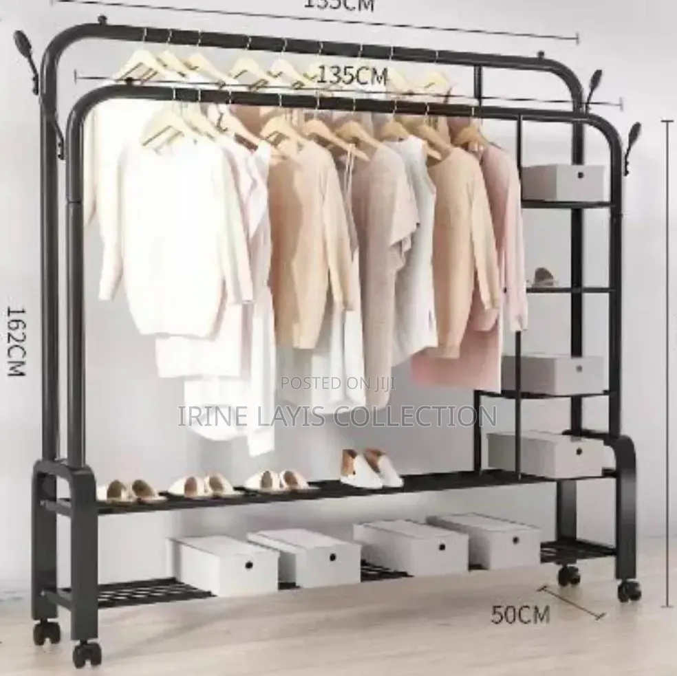 Double Rail Cloth Rack With Integrated Storage Shelves and Hooks.