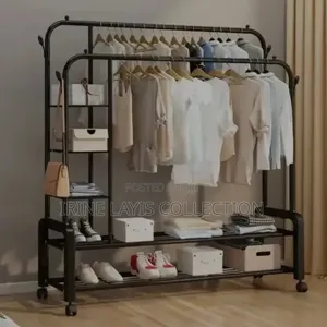 Double Rail Cloth Rack With Integrated Storage Shelves and Hooks.