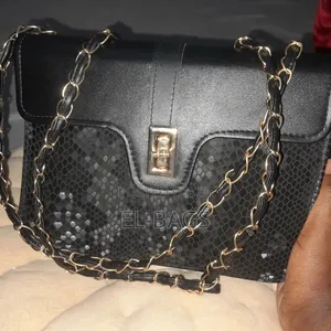 The Structured Black Python Shoulder Bag