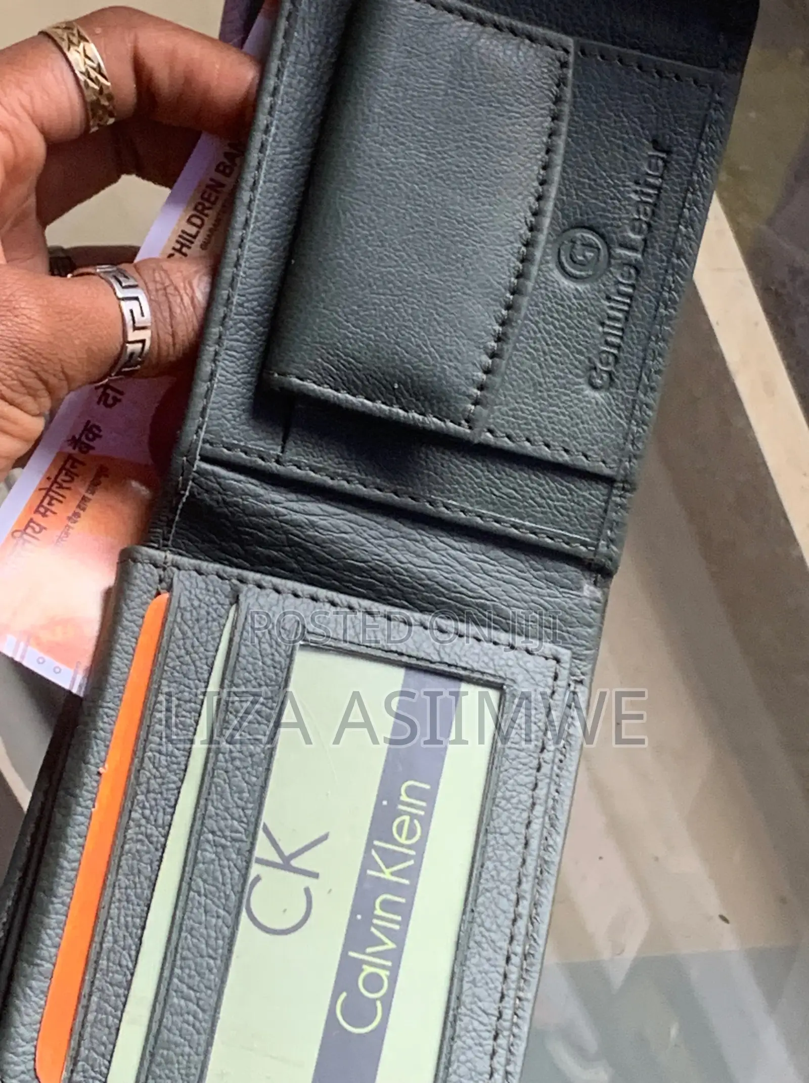 Calvin Klein Bi-Fold Wallet Featuring a Debossed Monogram Logo On