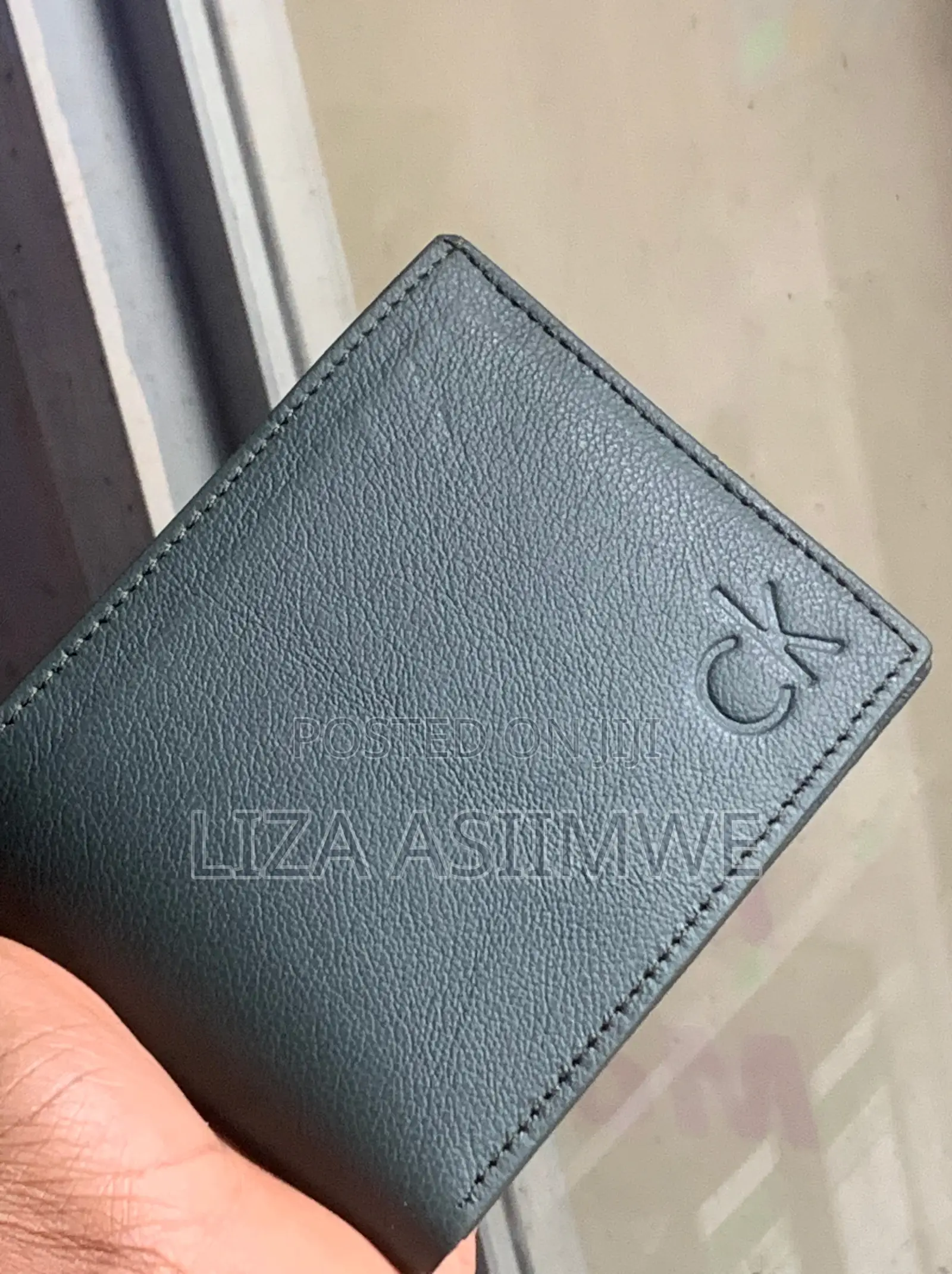 Calvin Klein Bi-Fold Wallet Featuring a Debossed Monogram Logo On