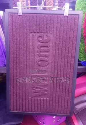 Dark Red, Vertical Ribbed Mat Features a Molded "Welcome" .