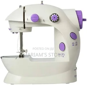Mini Sewing Machine Featuring a Purple and White Design.