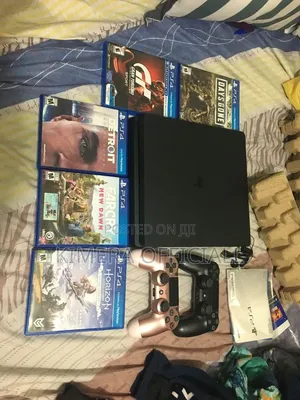 PlayStation 4 Slim (Almost Brand New) + 2 Controllers 12 Games