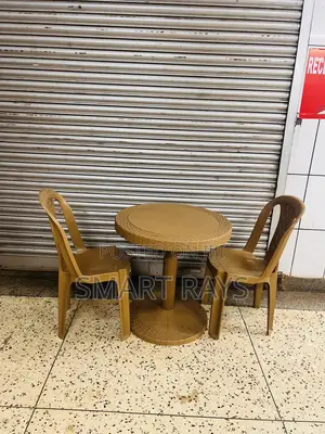 Round Plastic Table With Two Plastic Chairs