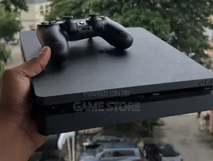Chipped PS4 Slim, 12 Games, 2 Pads, UGX, Kampala City Deal