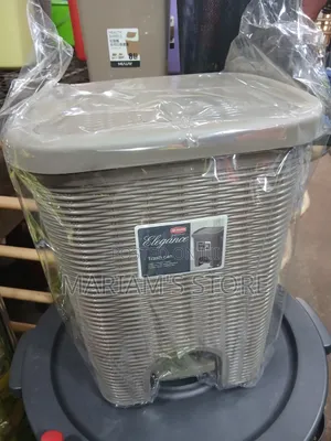Plastic Trash Can With a Foot Pedal Mechanism.