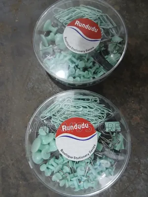 Clips, Push Pins, and Binder Clips in a Transparent Round Container