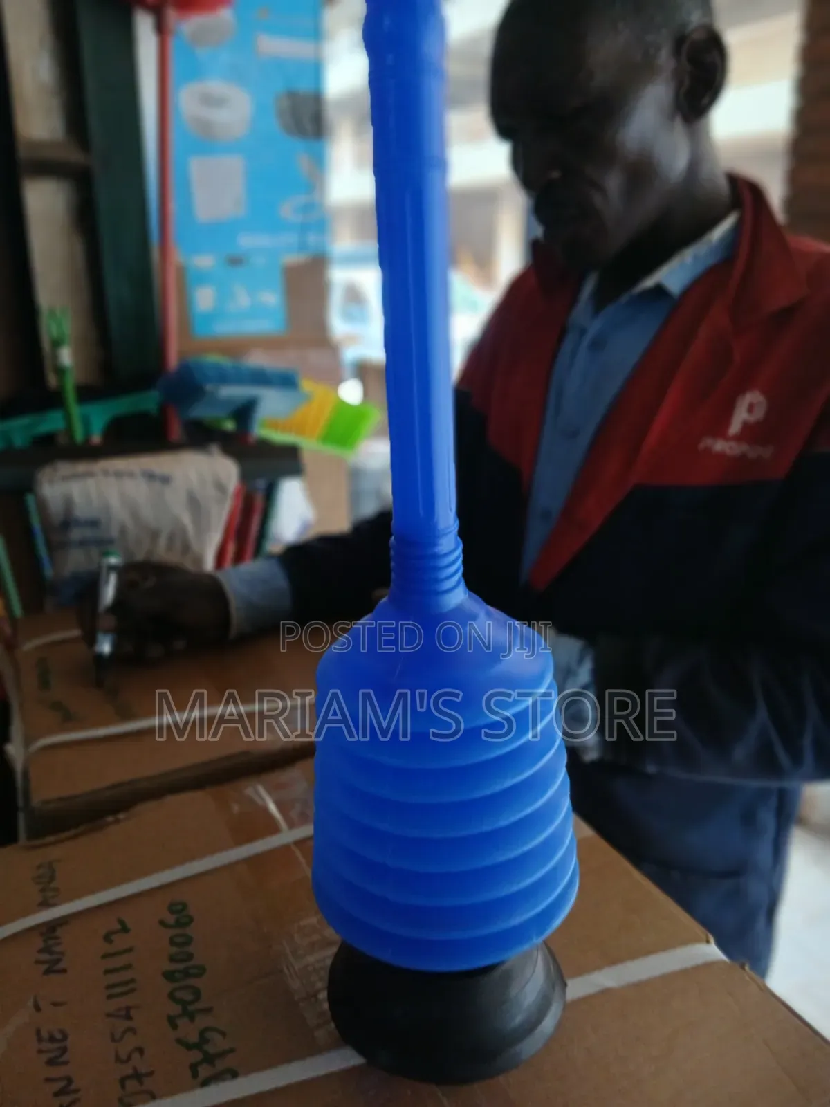 Toilet Plunger With a Black Rubber Suction Cup Base.