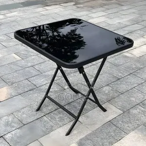 Black Outdoor Garden Table Features a Tempered Glass Top.