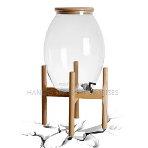 Large Glass Beverage Dispenser With Wooden Lid and Stand.