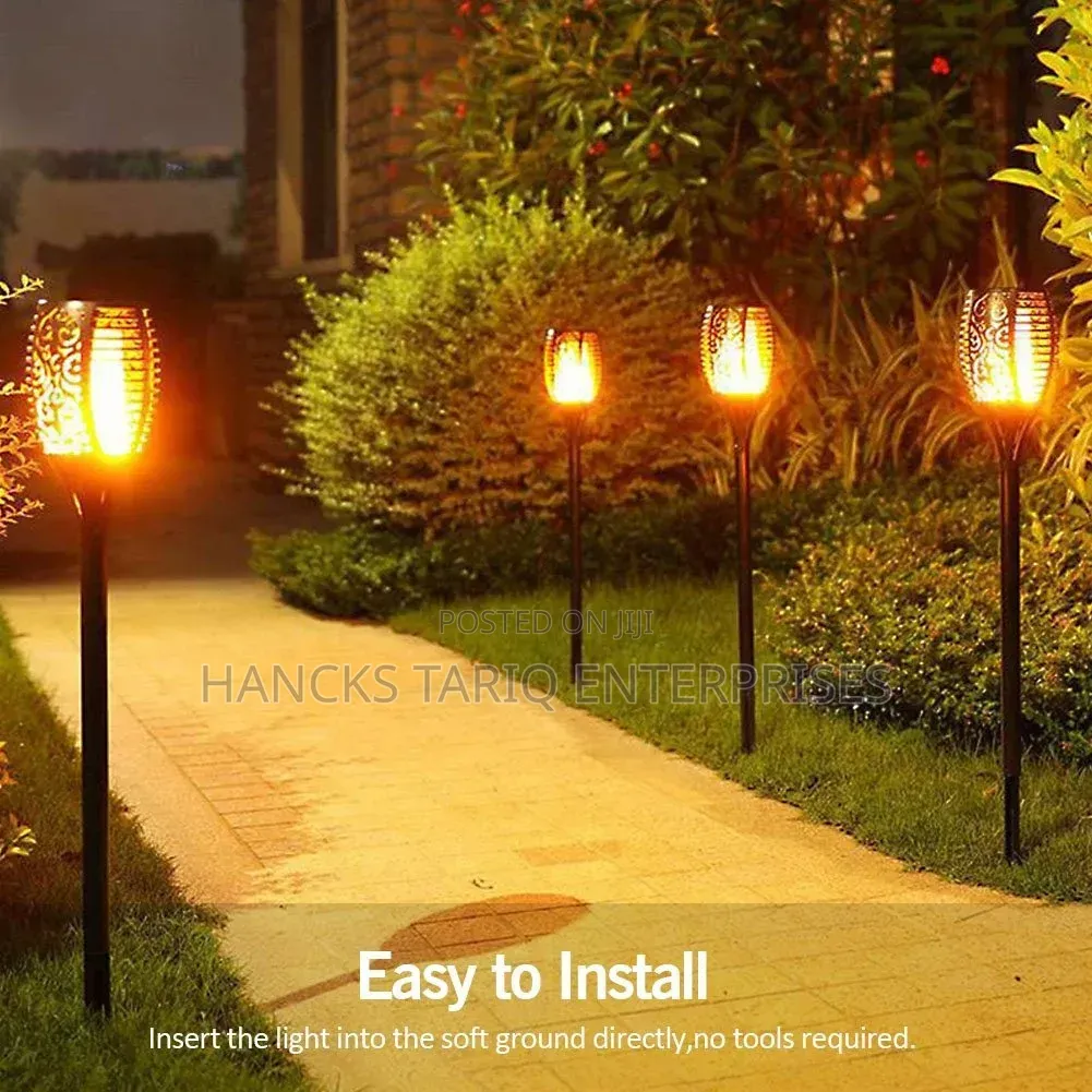 Solar-Powered Flickering Flame Garden Torch Lights.