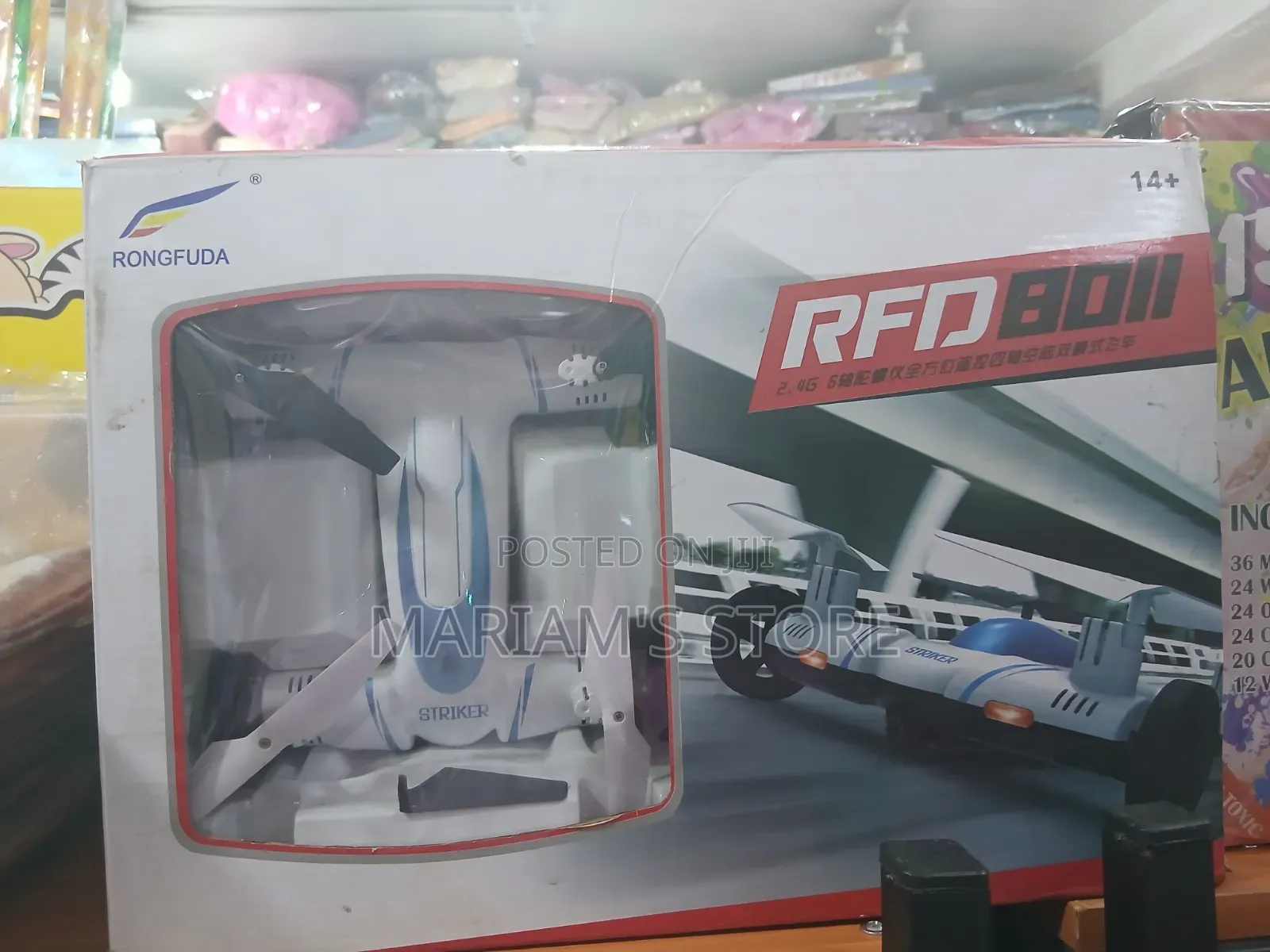 Hybrid Toy Designed to Both Drive on Land and Fly as a Quadcopter