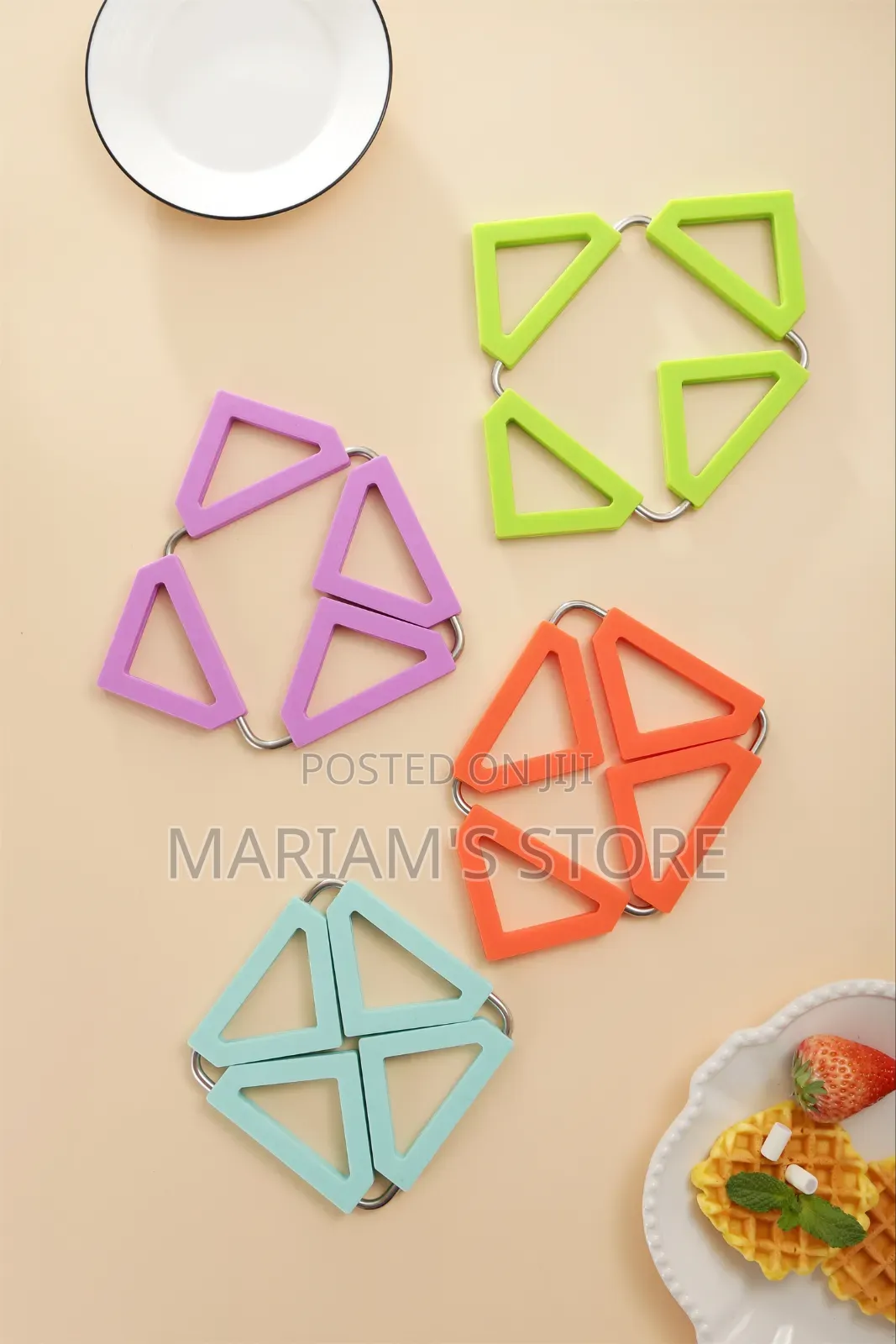 Expandable Silicone Trivet Mats Feature a Stainless Steel Frame.