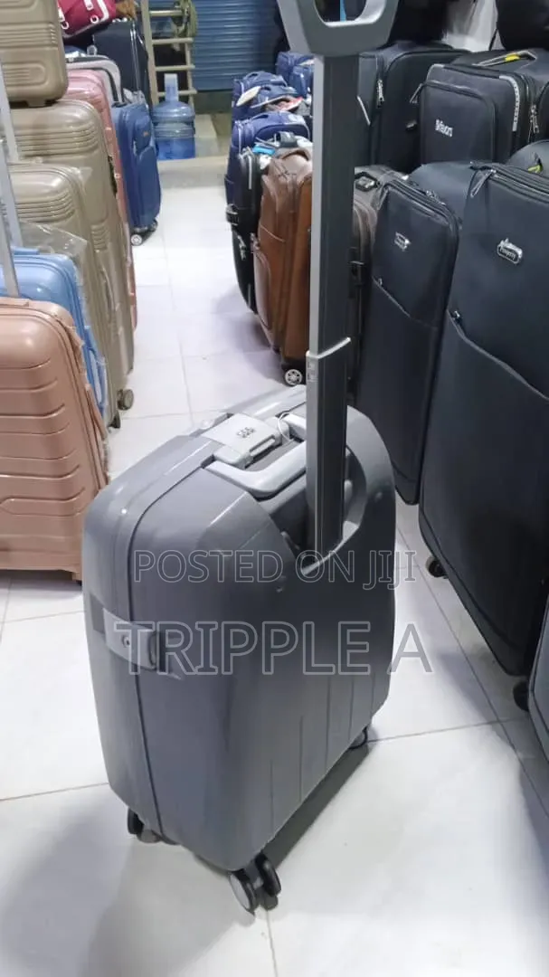 A Grey Hard-Shell Rolling Cabin Suitcase