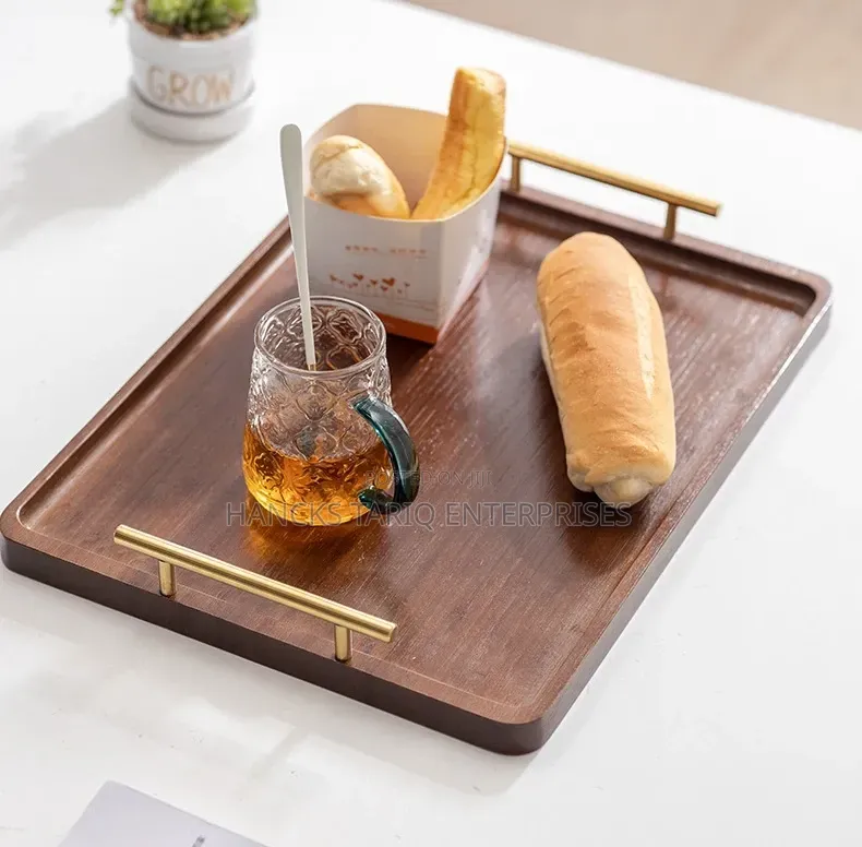 Set of Nested Wooden Serving Trays With Gold Handles.