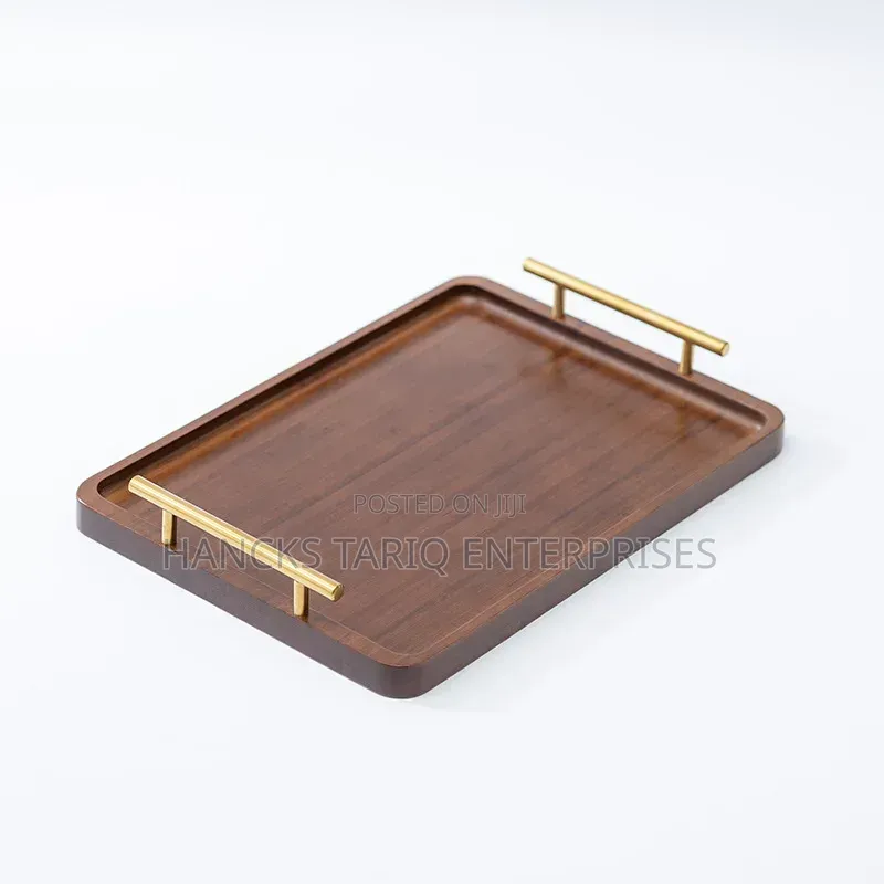Set of Nested Wooden Serving Trays With Gold Handles.