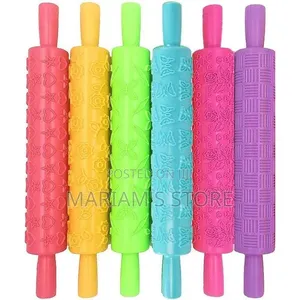 Plastic Embossed Rolling Pin Featuring a Textured Butterfly Pattern.