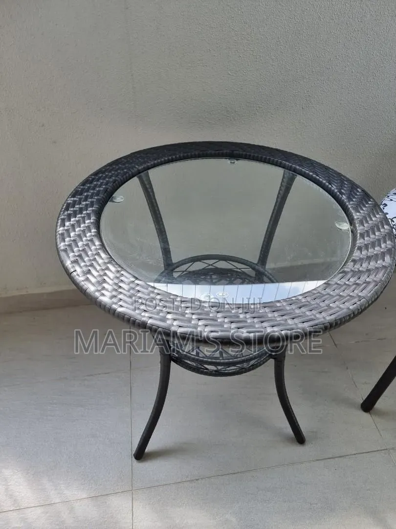 Round Glass Outdoor Table With Black Rattan Edging