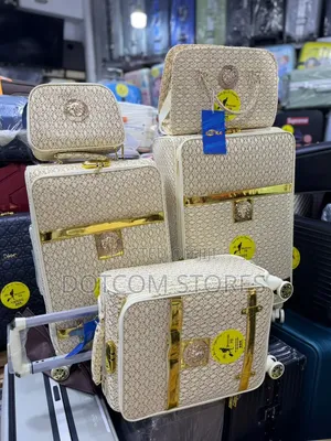 Beige and Gold Monogram Traveling Luggage Set