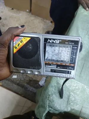 NNS Model NS-1521U 8-Band Radio With a Silver-Colored Casing