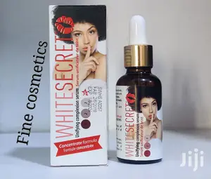 White Secret Lightening Unifying Complexion Vitamin E Serum.