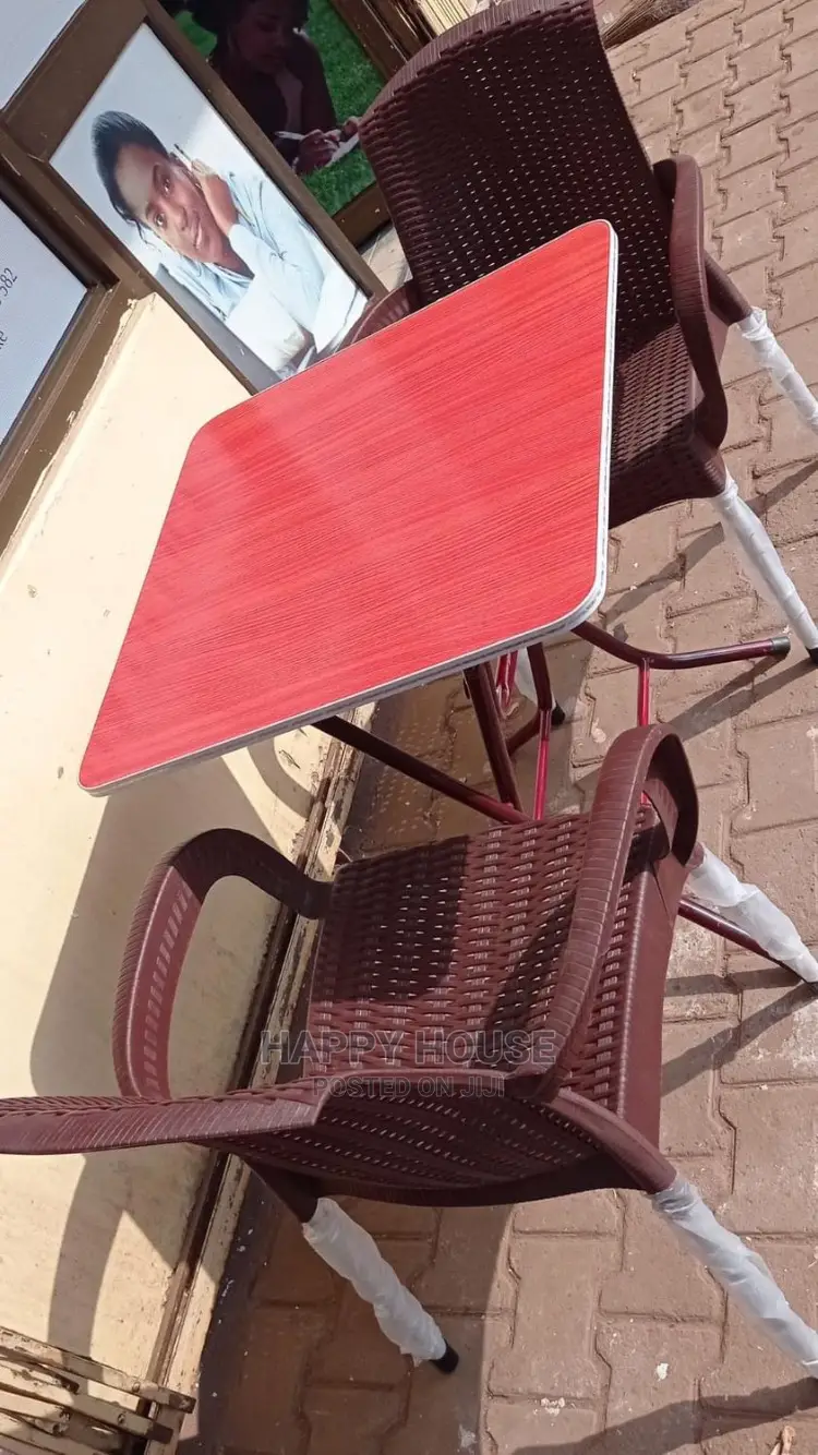 A Set of Foldable Table and 2 Plastic Strong Chairs