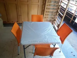 A Set of Table and Plastic Chairs
