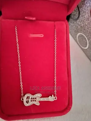 Unique Necklace With a Guitar Pendant Available With the Box